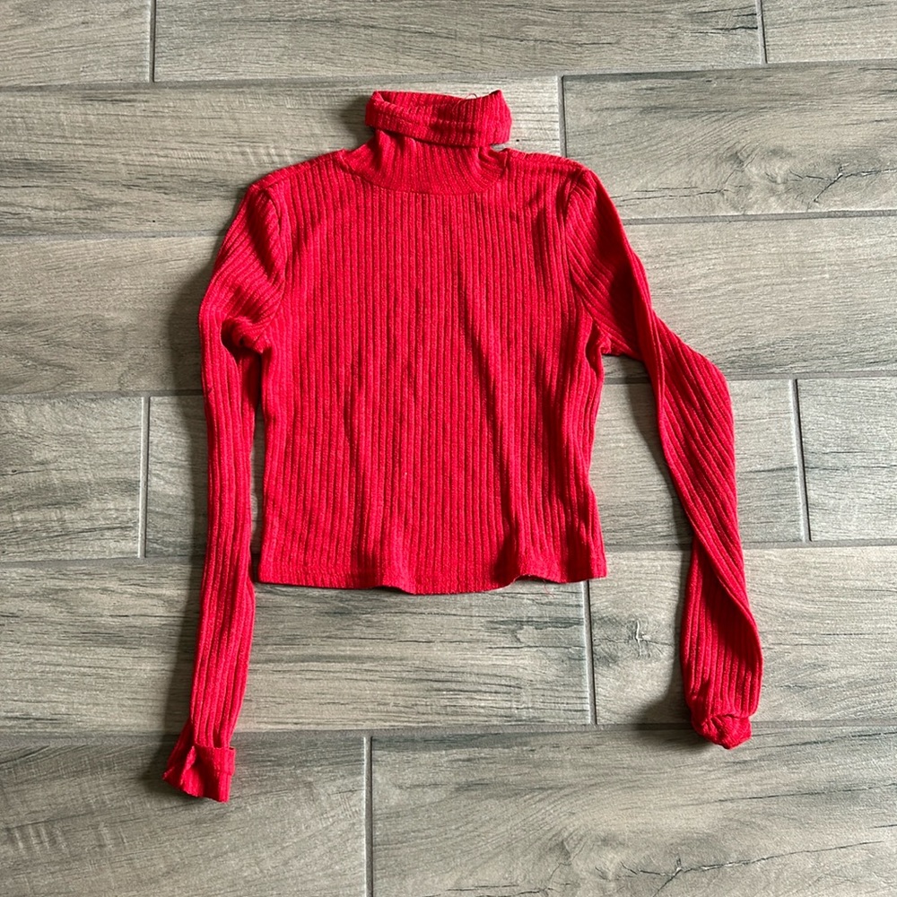 Red ribbed turtleneck with cuffed sleeves